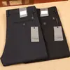 21 pantalones casuales de negocios rectos ajustados para hombre, gruesos, suaves, de fibra de poliéster microelástica, sin planchado, para otoño e invierno