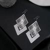 Pendientes de hoja hueca simple transfronterizos europeos y americanos, pendientes de borla larga de estrella de cinco puntas de múltiples capas creativos exagerados al por mayor