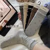 Nuevos calcetines de otoño e invierno florales con lazo, sin costuras, a media pantorrilla, calcetines de algodón dulces para mujer, calcetines de encaje, calcetines retorcidos apilados
