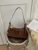 Bolso de mano retro de gamuza de nicho estilo coreano transfronterizo para mujer, nueva colección 2026, adecuado para el uso diario y para ir al trabajo, se puede llevar como bolso de hombro o bolso cruzado