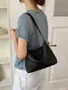 Bolso de hombro tejido casual de nicho para mujer, nuevo de verano 2026 versión coreana, bolso cruzado simple versátil tipo bollo ins