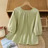 Foto real de la nueva blusa casual ligera de color liso estilo vintage de verano 2026 para mujer