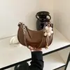 Bolsa de Ombro Feminina Transfronteiriça 2026 Novo Estilo Bolsa de Bolinho Nicho Grande Capacidade Deslocamento Diário Retro Ombro Único Super Quente Bolsa Transversal
