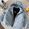 Chaqueta acolchada de algodón para niños, colección otoño e invierno 2026, top acolchado de algodón versátil para niños y niñas, chaqueta casual fina de algodón con capucha