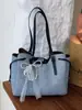 Bolso de mano grande casual de moda estilo coreano para mujer, nuevo modelo de verano 2026, bolso de hombro elegante de alta apariencia para el trabajo