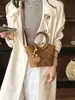 2026 Otoño Temprano Nuevo Bolso de Hombro Elegante de Nicho de Alto Valor Bolso de Mano Moderno Simple de Color Sólido Tipo Cubo Cruzado
