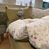 Conjunto de Quatro Peças de Algodão Kapok Fofo com Pompons Novo Estilo Primavera e Verão Cama de Estudante Conjunto de Fronhas para Edredom Floral Fresco e Fofo