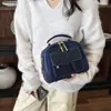 Bolsa de Mão Tendência Transfronteiriça Feminina Estilo 2026 Patchwork de Jeans Retrô Bolsa de Ombro Único Transversal Bolsa Quadrada Pequena Casual para o Trabalho