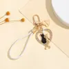 Estilo europeo y americano, lujoso y creativo, versátil, llavero de gato para pareja de alta gama, regalo exquisito, llavero de coche y charm para bolso