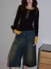 Camiseta Splicing Preta de Gola Redonda para Mulheres Outono 2025 Top Elegante de Alta Qualidade com Efeito Afinando a Cintura Manga Longa
