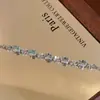 Nueva pulsera de trébol de cuatro hojas de alta calidad, flor de durazno, corazón oceánico continuo, para mujer, lujo ligero, circón, nicho de boutique