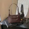 Bolso de mano de gamuza estilo coreano para mujer, nueva colección otoño/invierno 2026, bolso de hombro retro de moda, acabado mate, adecuado para ir al trabajo y llevar cruzado