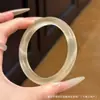 Ventas Directas de Fábrica Pulsera Color Dorado Champagne para Mujer Pulsera Blanca Translúcida Luna de Hielo Pulsera Colgante Plana Redonda Banda de Belleza Pulsera de Piedra Ojo de Gato