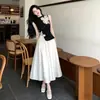 Conjunto de Ropa de Moda para Mujer 2026: Top de punto calado, Camiseta negra, Falda de tul fluida línea A, Estilo coreano ajustado