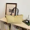 Nova bolsa tote de lona simples para o início do outono de 2026 para mulheres, bolsa de ombro de grande capacidade para o dia a dia, bolsa de mão com cor sólida e toque descontraído