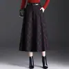 Falda de lana a cuadros de longitud media para mujer para el invierno 2026, nuevo diseño de cintura alta, que cubre las caderas, adelgazante, retro y con una caída fluida