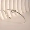 Pulsera de Anillo Liso Nudo Corazón de Melocotón Retro Europea y Americana para Mujer, Lujo Accesible, Diseño de Alta Gama, Elegante a la Moda, Joyería de Mano Versátil para el Día a Día
