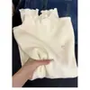 Camisa base de borde de oreja de madera estilo miu exquisita francesa para mujer, otoño e invierno, cuello medio alto, prenda interior, suéter, top de punto de manga larga
