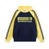 Sudadera con Capucha de Rayas Bloque de Color Estilo Americano para Hombres y Mujeres, Tendencia Nacional Otoño e Invierno Holgada Casual Sudadera Superior para Parejas