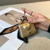 Nuevo Famoso de Internet Más Vendido Versátil Exquisito Billetero Exquisito Corazón en Relieve Mini Llavero de Cuero Encanto para Bolso
