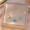 Collar Popular Transfronterizo de Trébol de Cuatro Hojas de Acero de Titanio para Niñas, Lujo Ligero y Versátil Nuevo Conjunto de Cadena Clavicular de Cinco Flores de Doble Cara