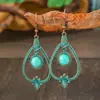 Pendientes de aleación con borla hueca turquesa transfronterizos figura geométrica femenina estilo nacional clásico pendientes joyería al por mayor
