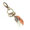 Llavero de coche con alas de bronce estilo punk vintage, de cuero genuino, ideal como regalo creativo, para mochila de mujer.