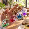 Colgante acrílico relleno de aceite con arena movediza, nube de sirena, llavero lindo, accesorio para mochila de estudiante, pequeño regalo exquisito