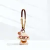 Colgante de Peluche Lindo Cachorro con Gafas Correa para Bolso Muñeco Adorno Regalo de Navidad Llavero Correa para el Cuello