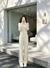 Conjunto de roupas esportivas casuais estilo coreano 2026 para mulheres, outono/inverno, que reduz a idade e emagrece, apresentando uma blusa com gola alta e calças de perna larga, um conjunto de duas peças moderno