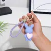 Llavero creativo de oso de amor que lleva una buena matanza corriendo con la misma muñeca de pareja llavero colgante bolso de coche colgante
