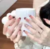 Uñas Portátiles de Alta Gama para Año Nuevo: Rojo Retro Cisne Puntos, Ojo de Gato Francés, Moño, Brillo Deslumbrante, Manicura Hecha a Mano que Realza el Cutis