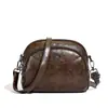 Bolsa Pequena Redonda Retro de Couro Macio Mais Vendida no Exterior para Mulheres Nova Simples Casual Grande Capacidade Multicamadas Ombro Único Transversal