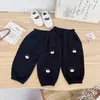Pantalones deportivos nuevos de forro polar para otoño e invierno, para niños y niñas, parche de oso de dibujos animados, corte holgado, con puños, pantalones para bebé al por mayor