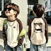 Camiseta base de forro polar alemán de doble cara para niño otoño e invierno estilo coreano prenda superior camiseta base capa interior cuello redondo bloques de color de dibujos animados manga larga