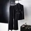 Elegante conjunto de traje negro de doble botonadura para mujer, atuendo profesional con pantalones ligeramente acampanados, conjunto de dos piezas para entrevistas y trabajo