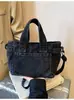 Bolsa de mano de mezclilla para mujer, gran capacidad, nuevo modelo verano 2026, simple y elegante, bolso de un solo hombro para la escuela y el trabajo