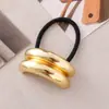 Estilo punk europeo y americano metal personalidad alta calidad cuerda para la cabeza semicírculo tubo redondo anillo para el pelo cuerda elástica para el pelo Balot fabricantes al por mayor