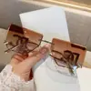 Novos Óculos de Sol de Metal Fashion Sem Aro Borda Cortada Armação Grande Perna Curva Letra Oca para Mulheres Estilo Coreano Tendência Estilo de Rua