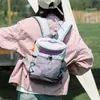 Mochila funcional de colorblock estilo macaron con múltiples correas externas, adecuada para estudiantes, para ir al trabajo y para excursiones al aire libre, ligera y fácil de guardar.