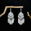 Pendientes geométricos redondos de estilo étnico transfronterizo europeo y americano, con borlas largas y atracciones turísticas retro bohemias.