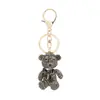 Colgante de Mochila de Oso de Diamantes Completos Coreano Nuevo Llavero de Coche Colgante de Aleación con Lazo de Color Wholesale de Yiwu