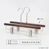 Percha para pantalones de madera maciza en color nogal negro, especialmente para tiendas de ropa, para uso doméstico y de hotel, sin marcas, antideslizante, percha con pinza de madera para pantalones al por mayor