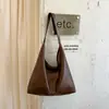 Bolso de Hombro Individual Texturizado Color Sólido Retro 2026 Otoño Nuevo Casual Personalidad Gran Capacidad Bolso de Mano para el Trabajo Moderno