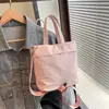 La popular bolsa tipo cubo de este año 2025 nuevo estilo coreano de nailon casual versátil de un solo hombro bandolera bolsa de mano elegante