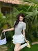 Camiseta corta de estilo coreano, dulce y fresca, de dos piezas falsas en blanco y negro para mujer, nueva de verano 2026, top ajustado que marca la cintura