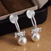 Pendientes de perla con lazo de circonita estilo coreano, clips para orejas tipo espiral para mujer, lujo ligero, moda de alta gama, pendientes elegantes y deslumbrantes