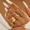Anillo de Oro Estilizado Exagerado con Líneas Doradas de Lava Asimétrico Forma de Gota de Agua Brillante Juego de Anillos 15 Piezas