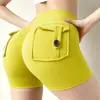 Nuevos shorts de yoga estilo ropa de trabajo transfronteriza con diseño de trasero en forma de durazno, cintura alta, tela elástica, efecto levanta glúteos, cierre de botón y material de secado rápido; hecho a medida