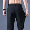 Calças Casuais Masculinas de Verão Finas Estilo Coreano High-End Elásticas Slim-Fit com Zíper Antifurto Cor Sólida Secagem Rápida Calças de Perna Reta